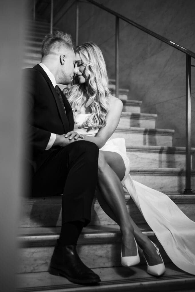 Quiet moment between the couple on the stairs during engagement session at the Ohio Statehouse