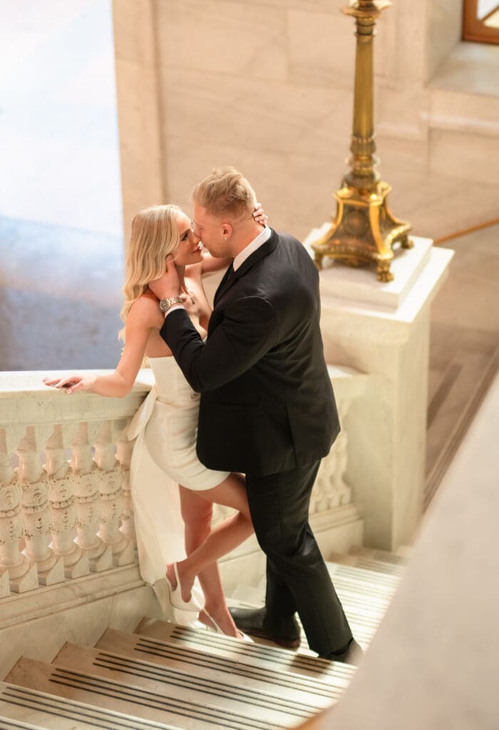 bride and groom on stairs at the ohio statehouse