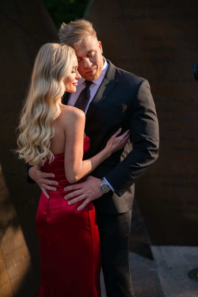 Romantic photo of Bride in red dress with her groom downtown columbus