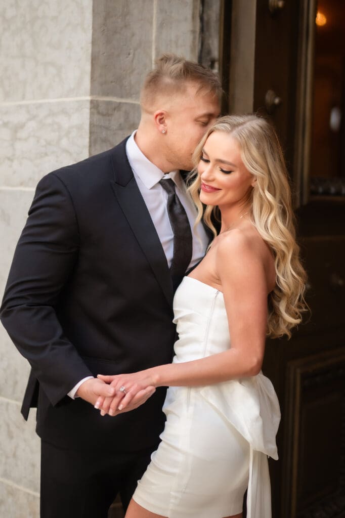 Bride and groom sharing a quiet moment with historic Ohio Statehouse in the background