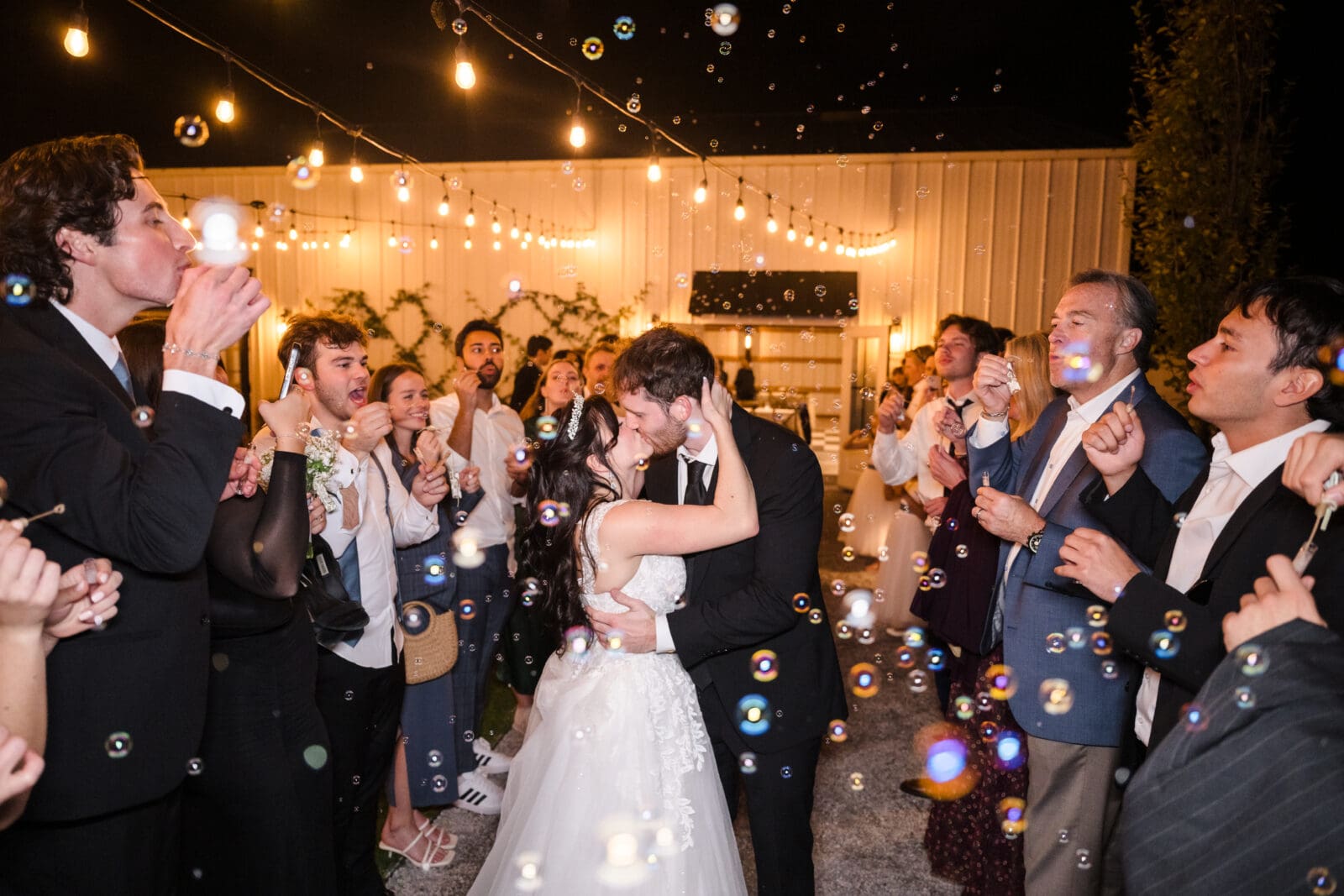 High energy wedding reception at Aspen & Alston during garden party celebration couples bubble send off 