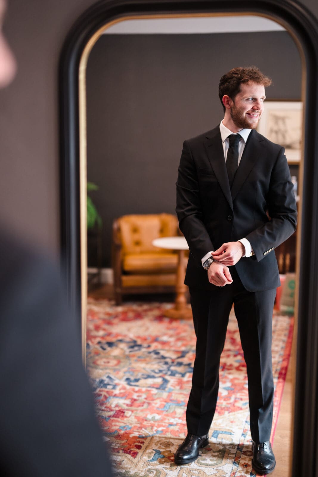 groom getting ready in grooms suite at Aspen & Alston garden party wedding