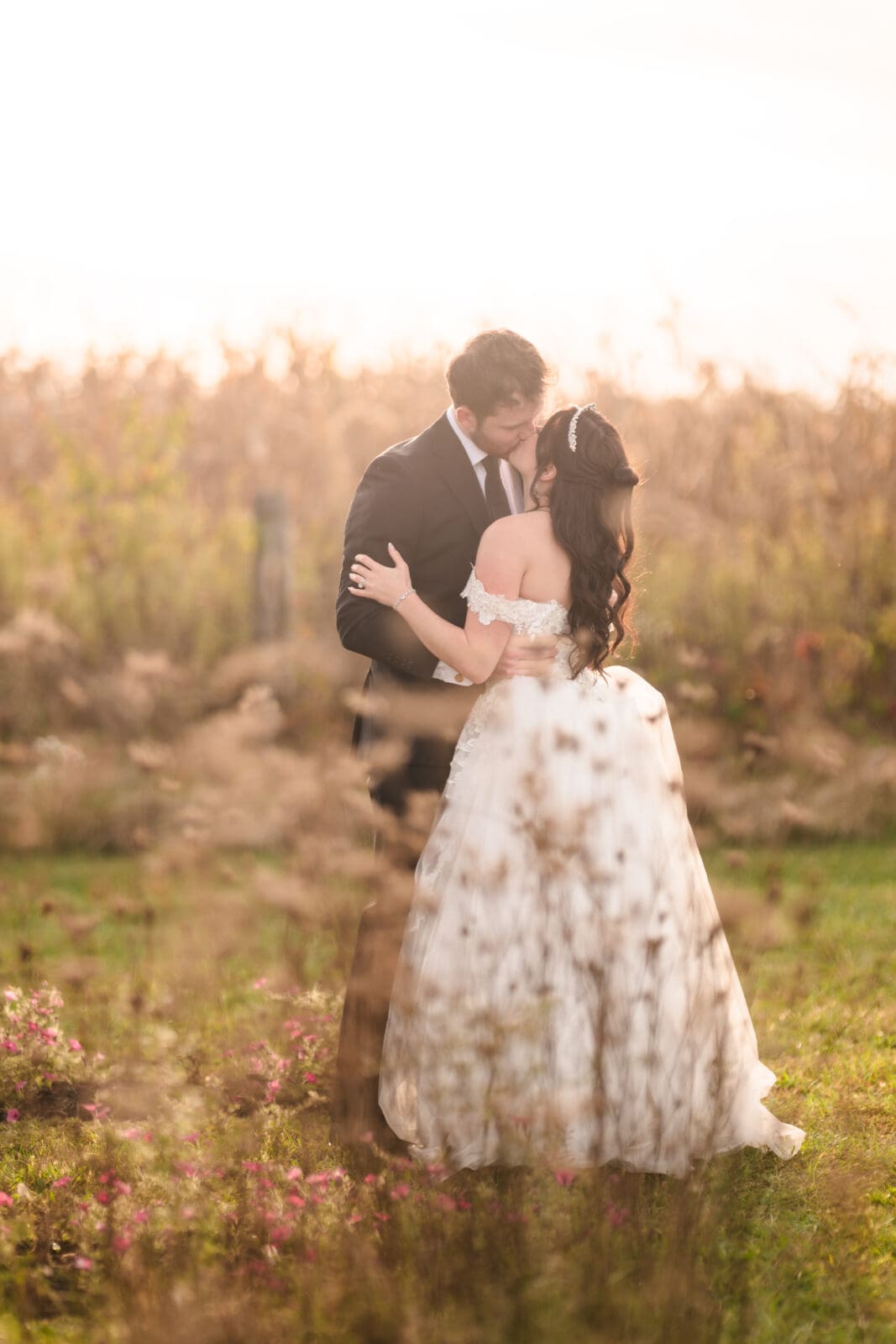 Romantic wedding portraits at Aspen & Alston with natural and elegant style couple kissing 