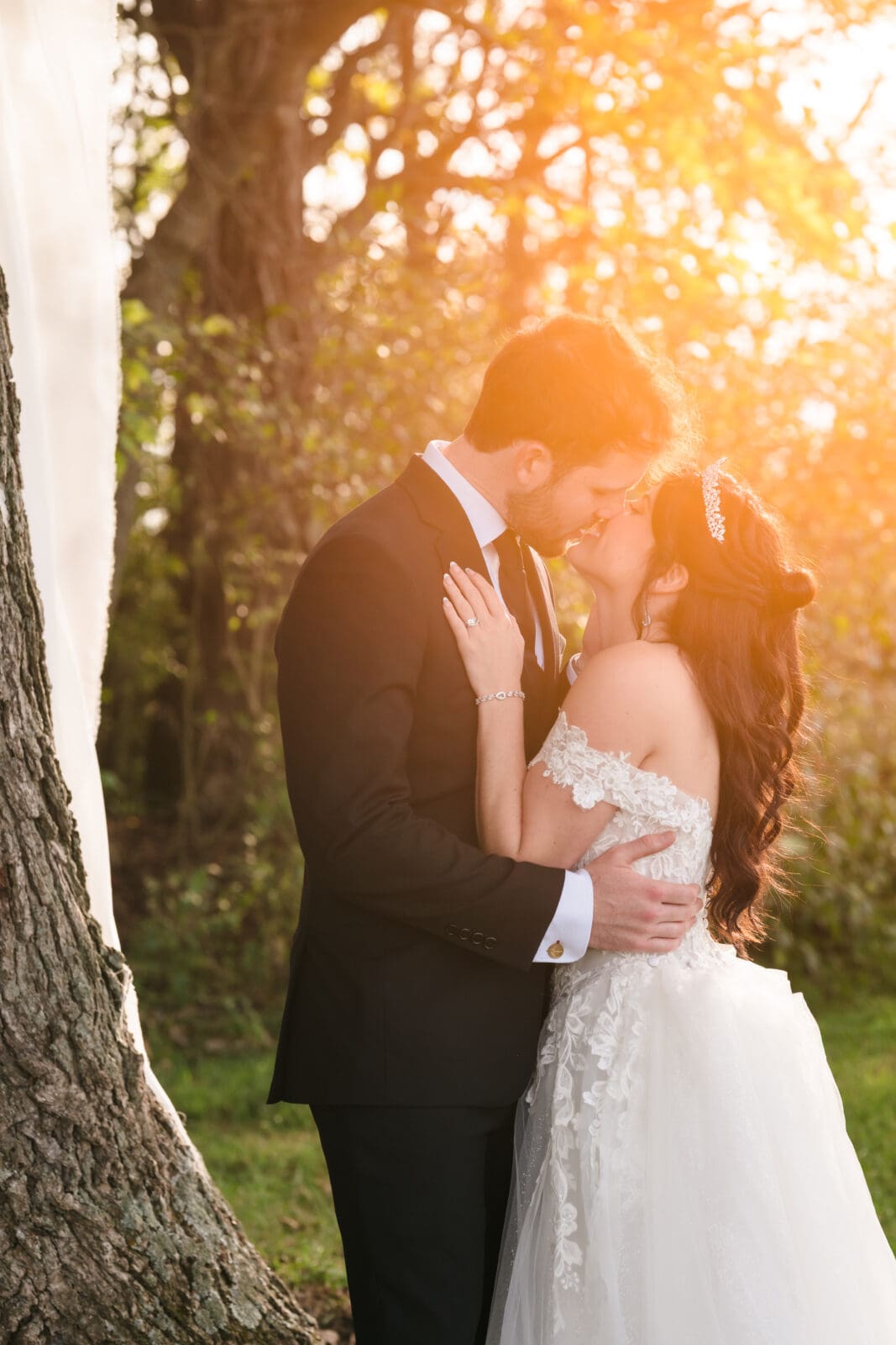 Intimate couple portraits during Aspen & Alston garden party wedding couple kissing during golden hour