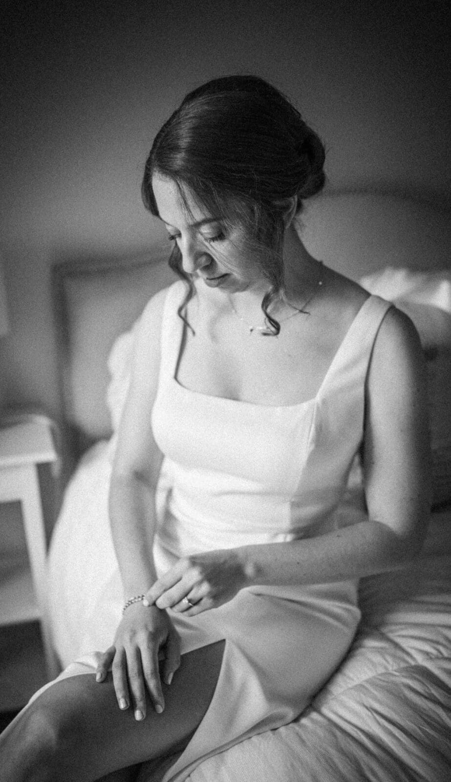 Bride sitting introspectively wearing wedding dress in Columbus Ohio