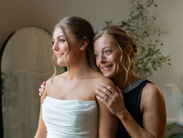 Close up of mother of the bride hugging her daughter at Retreat 21