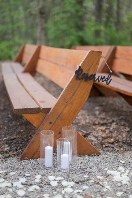 Close up of reserved sign on bench for wedding ceremony at Retreat 21