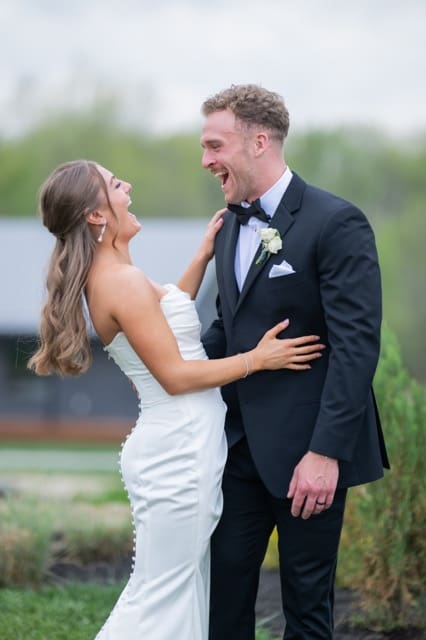 Couple laughing together on their Retreat 21 wedding day